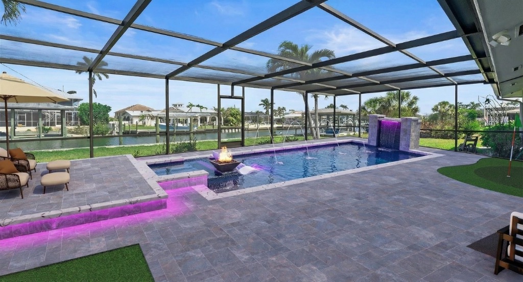 Estero Escape luxury pool with LED lighting waterfront canal views Southwest Florida