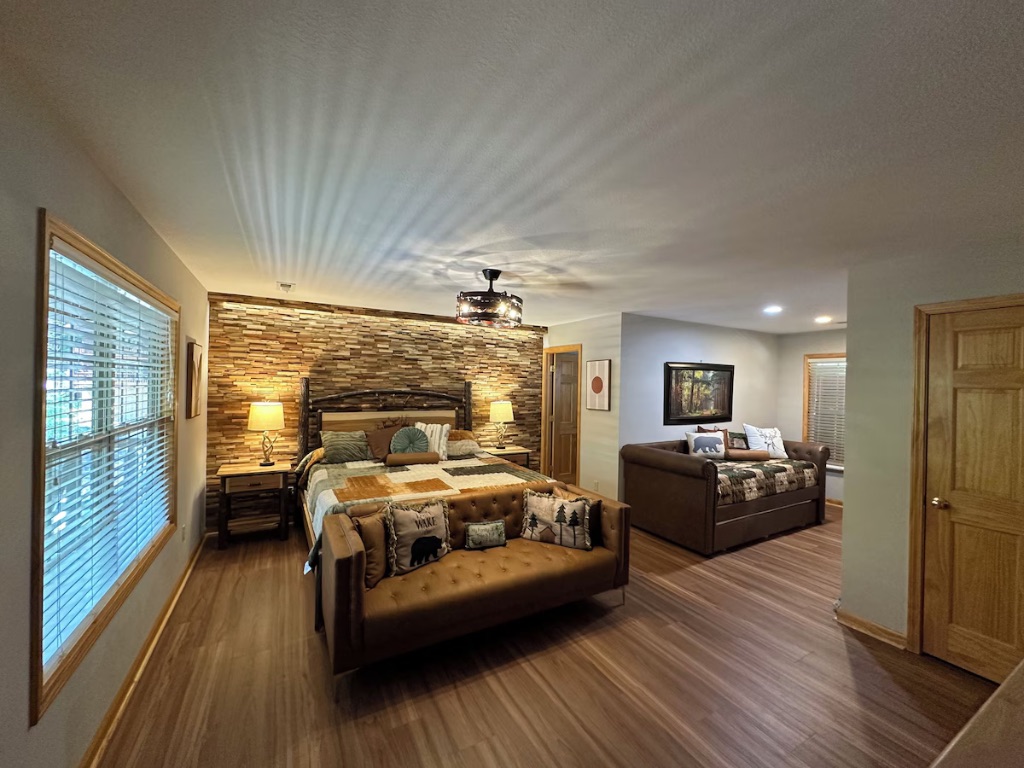 Pigeon Hills master suite alternate angle showing king bed seating area and bedroom layout